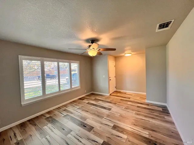 a view of an empty room with a window