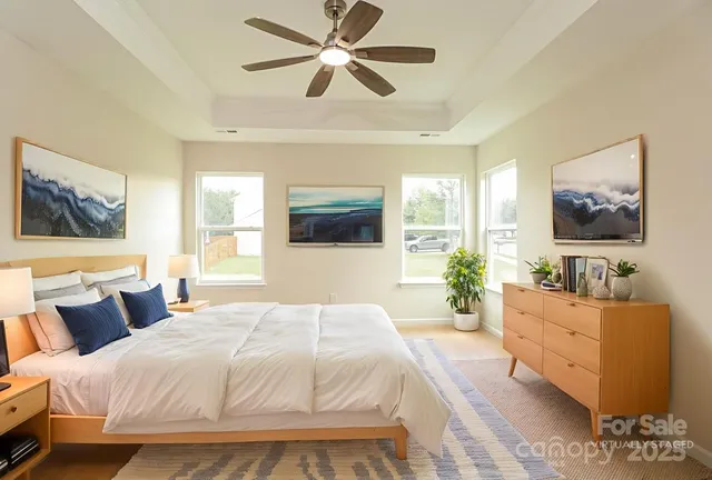 a bedroom with a large bed and a flat screen tv