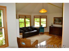 187 Jaynes Mtn. Road Canton, NC 28716 - Photo 8 of 24 a living room with furniture and a chandelier