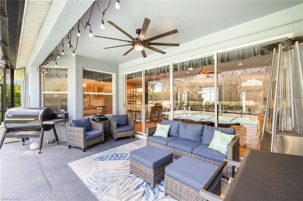 9890 Rookery Circle Estero, FL 33928 - Photo 23 of 26 a living room with furniture and a large window