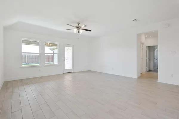 a view of empty room with windows