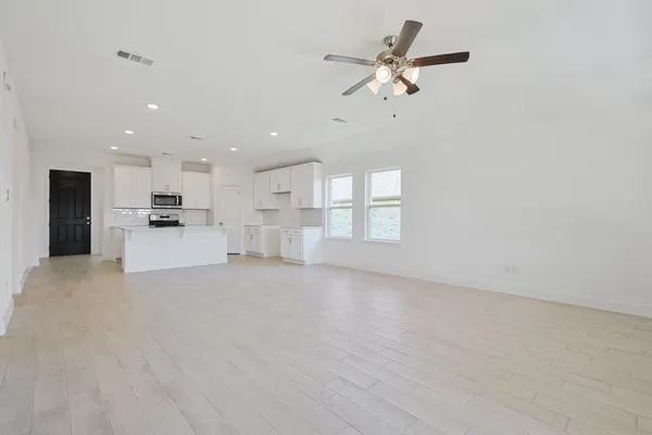 a view of a kitchen with furniture and a kitchen