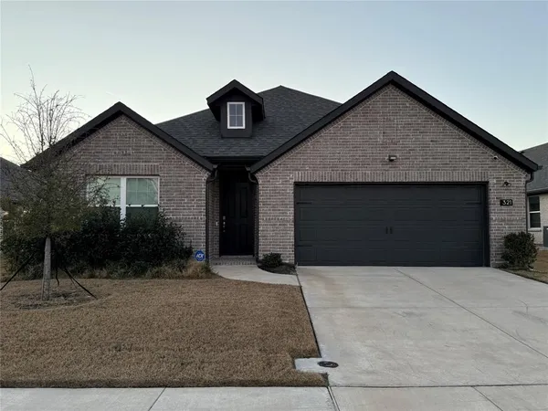 a front view of a house with yard