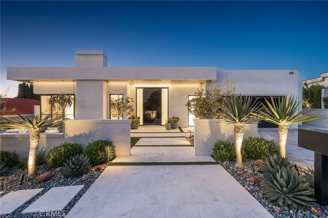a view of entrance gate of house and car parked