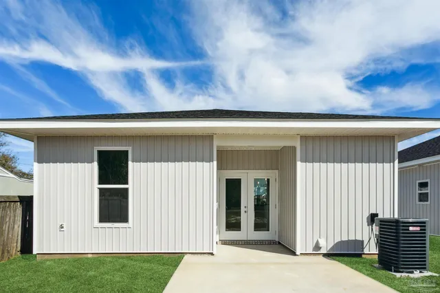 a view of backyard with seating space