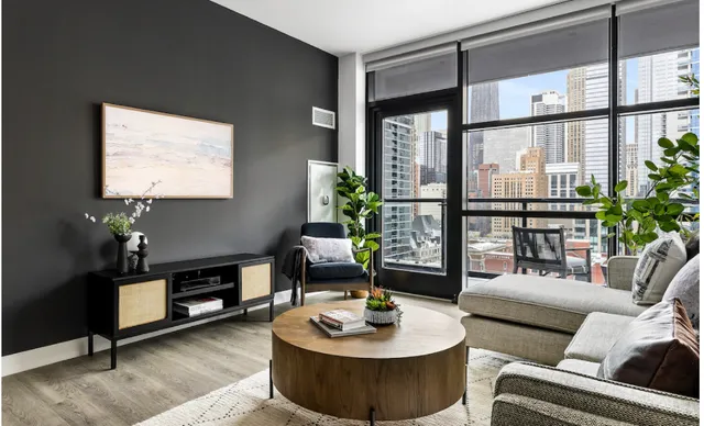 a living room with furniture and a flat screen tv