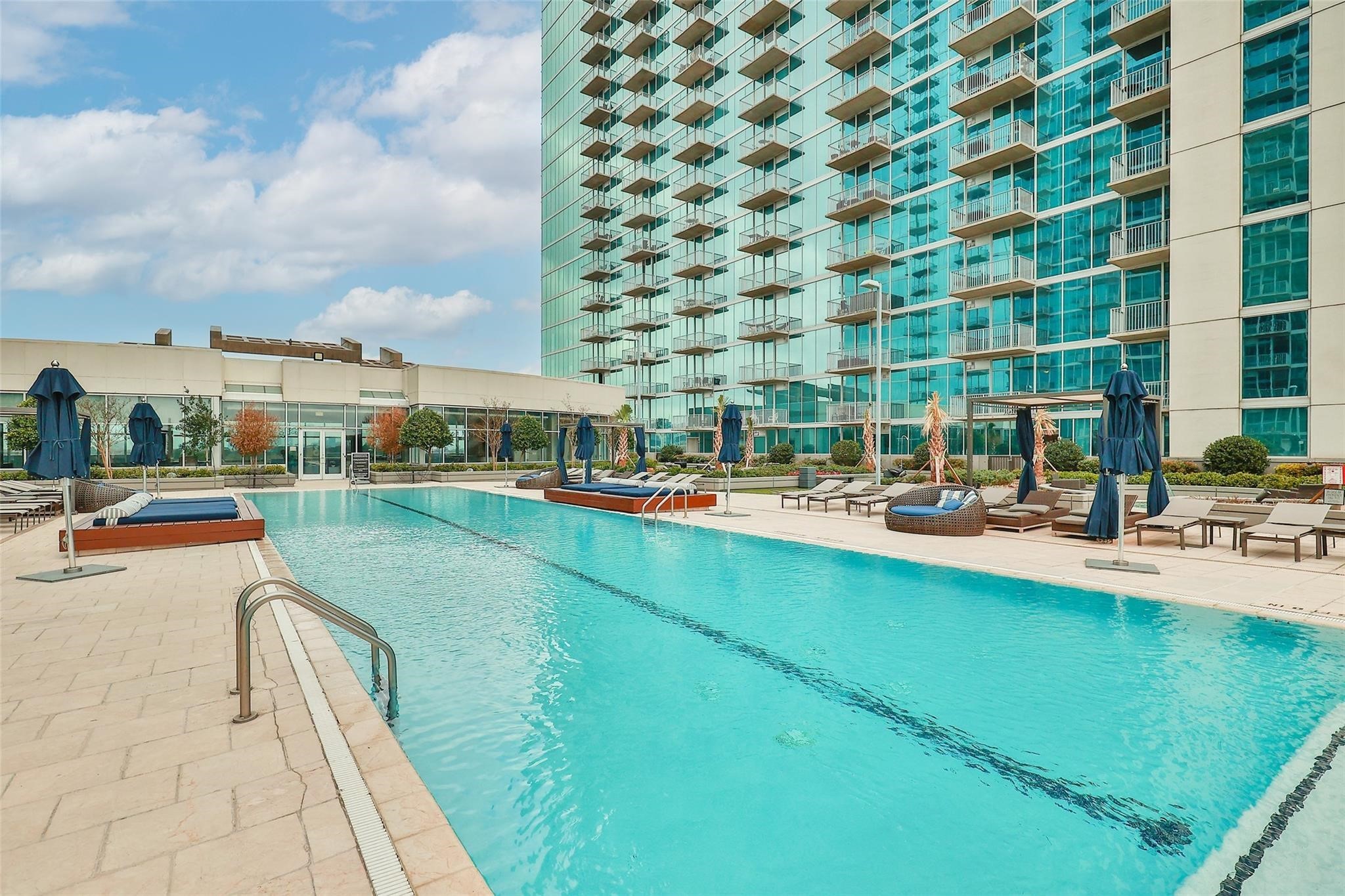 5925 Almeda Road, Unit 12308 Houston, TX 77004 - Photo 40 of 48 a swimming pool with outdoor seating and yard