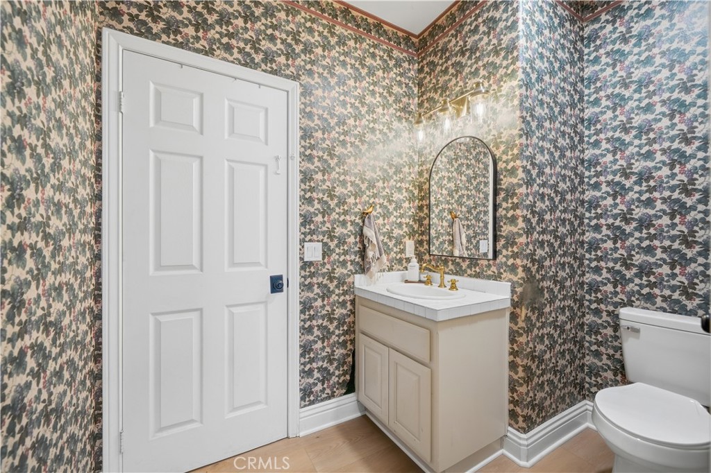 41110 Los Ranchos Circle Temecula, CA 92592 - Photo 44 of 77 a bathroom with a sink toilet and vanity