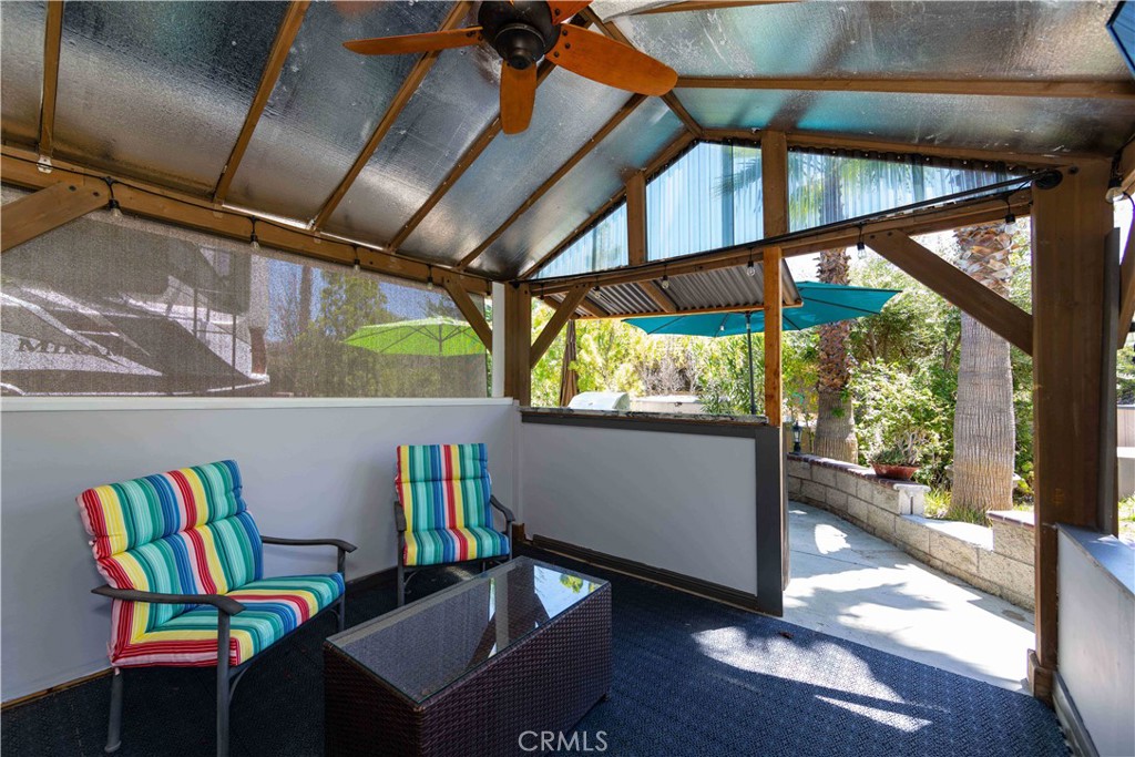 45525 Highway 79 Aguanga, CA 92536 - Photo 12 of 22 a view of a dining room with furniture a chandelier and wooden floor