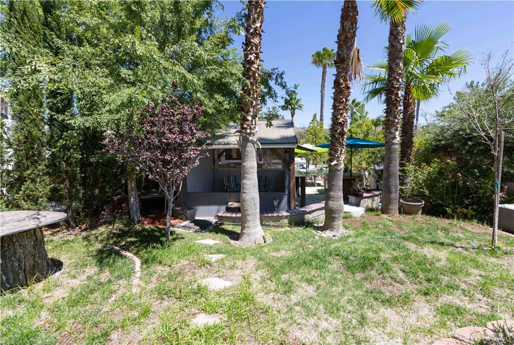 45525 Highway 79 Aguanga, CA 92536 - Photo 16 of 22 a view of a chair and table in backyard of the house