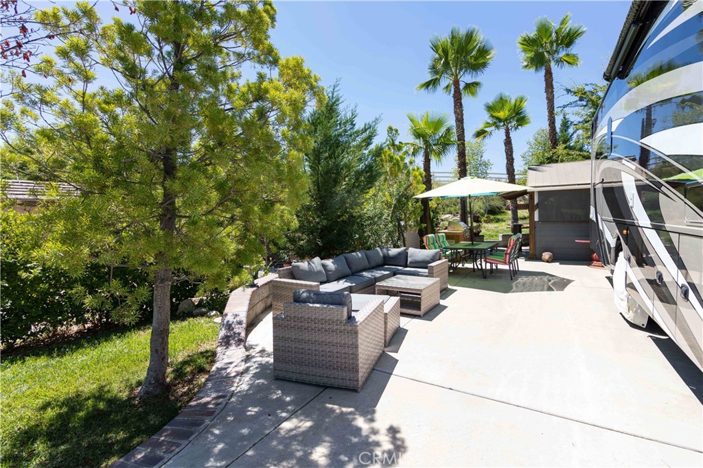 45525 Highway 79 Aguanga, CA 92536 - Photo 5 of 22 a view of a patio with table and chairs potted plants and large tree
