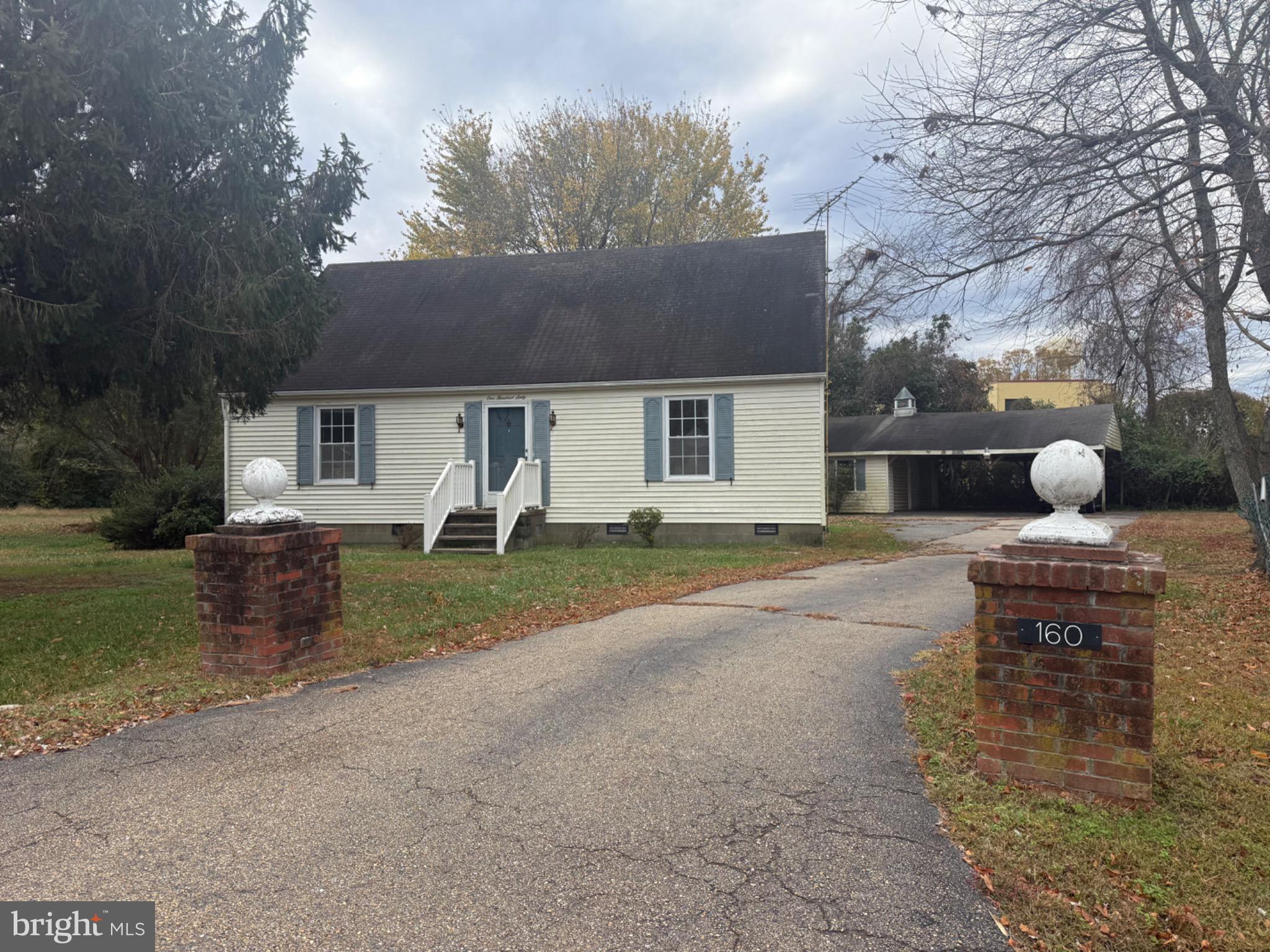 a house view with a backyard space
