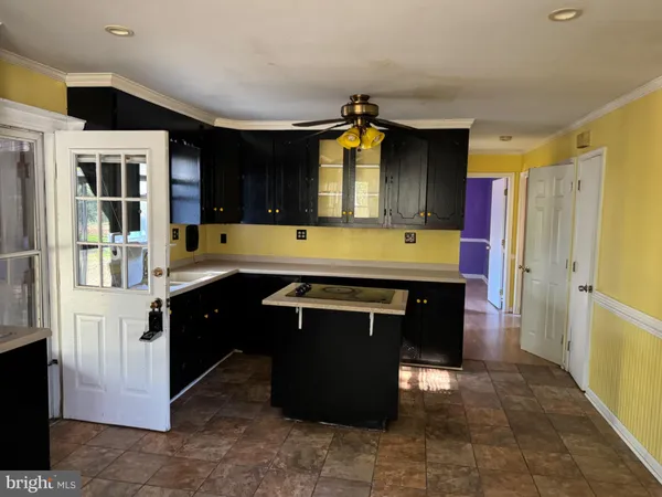 a kitchen with a refrigerator and a stove