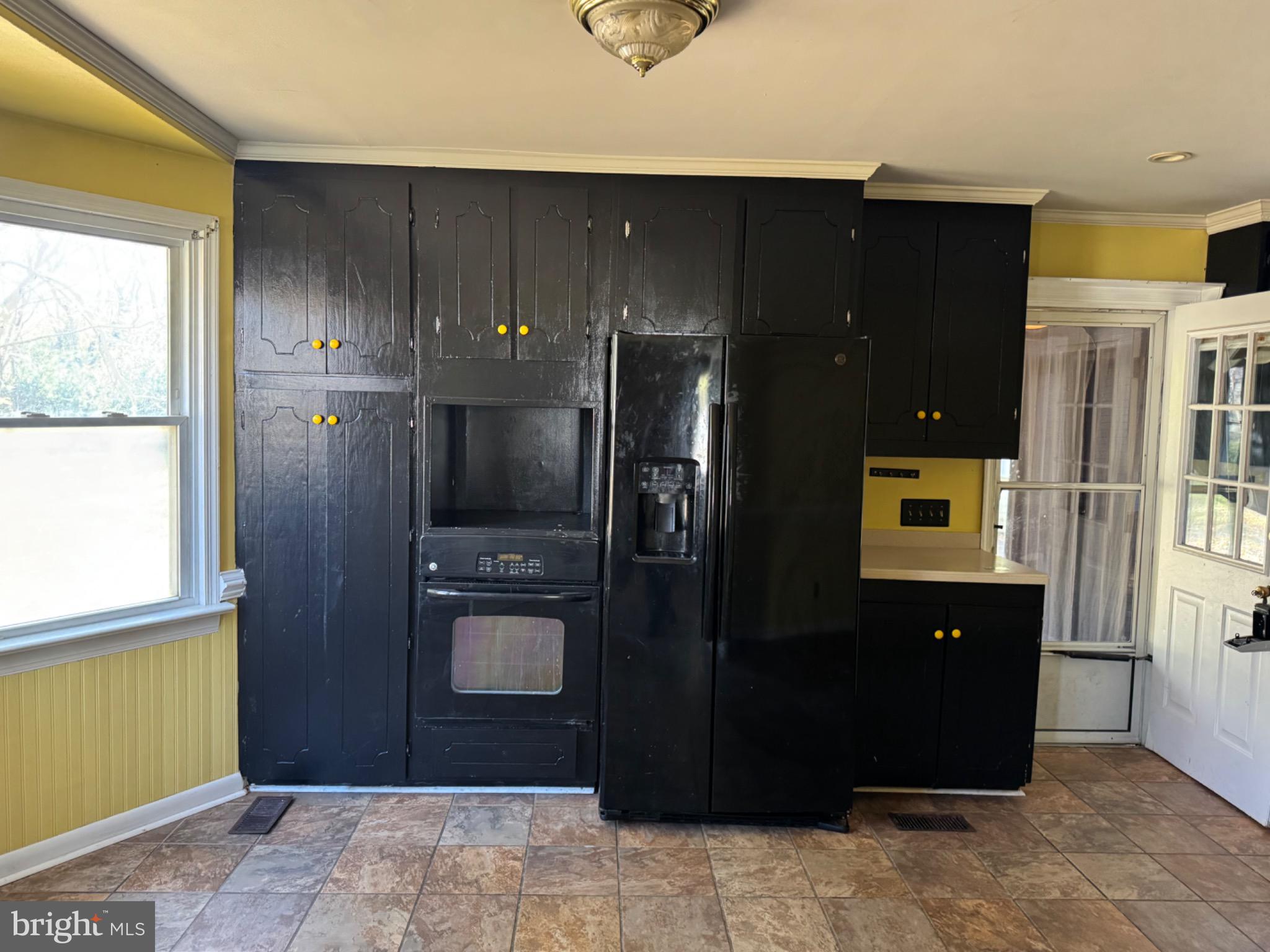 160 Rouzie Drive Tappahannock, VA 22560 - Photo 4 of 10 a kitchen with a refrigerator and a stove