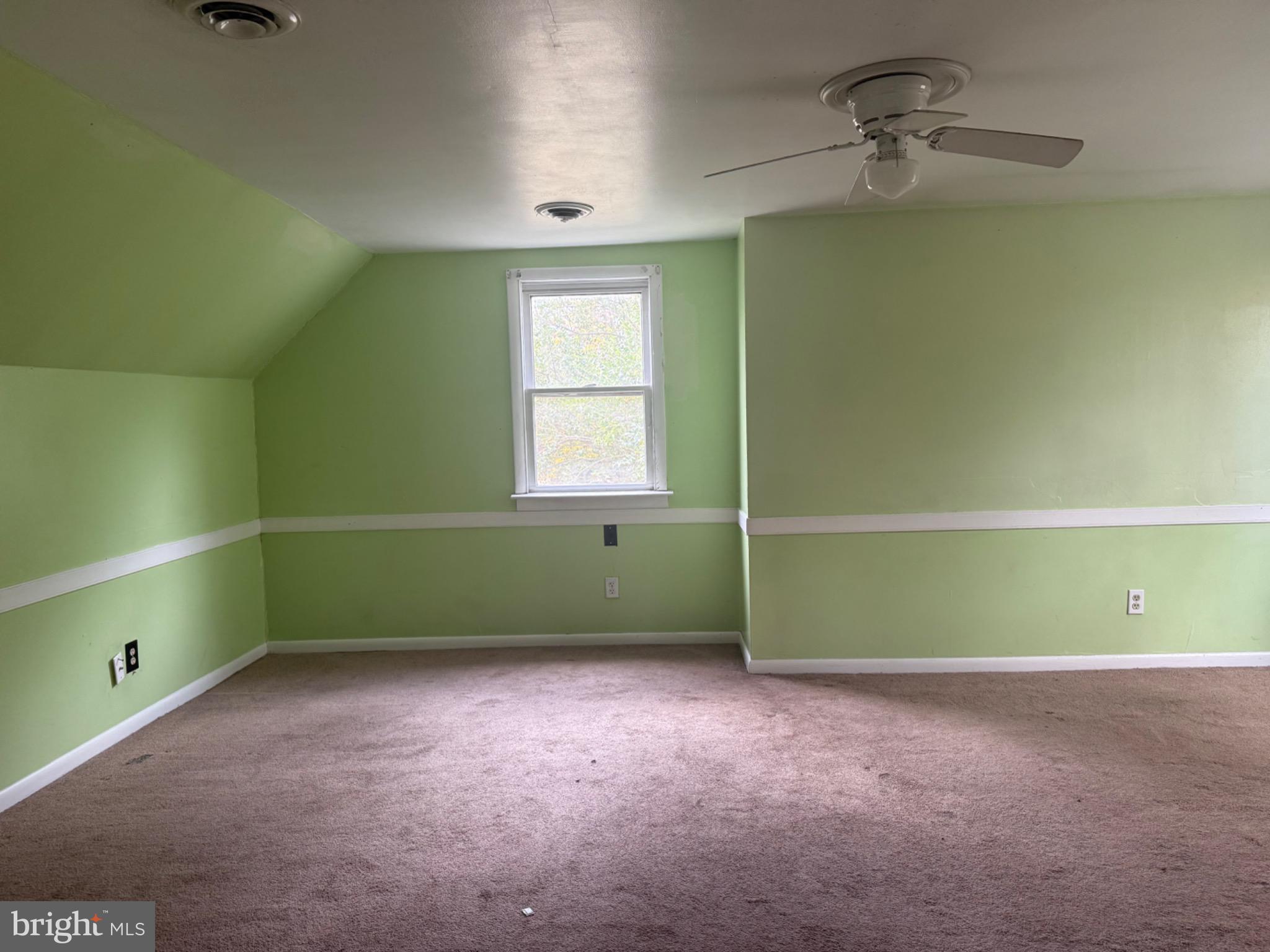 160 Rouzie Drive Tappahannock, VA 22560 - Photo 7 of 10 a room with a window and a ceiling fan