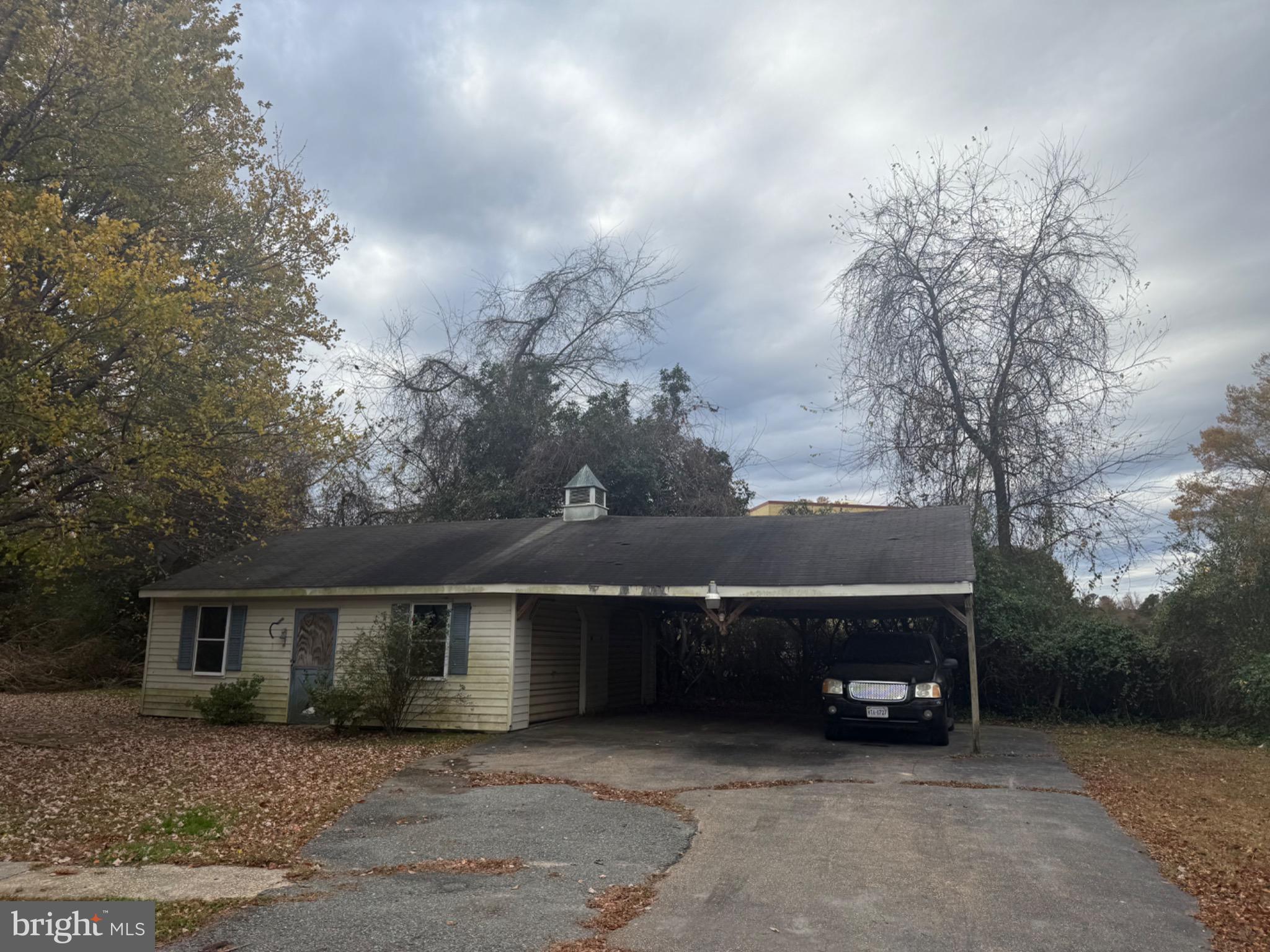 160 Rouzie Drive Tappahannock, VA 22560 - Photo 8 of 10 front view of house with a garden