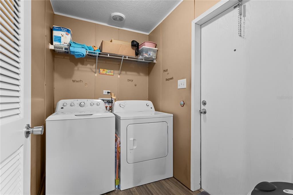 1650 Lyman Hendry Road, Unit 1 Perry, FL 32347 - Photo 13 of 30 a utility room with dryer and washer