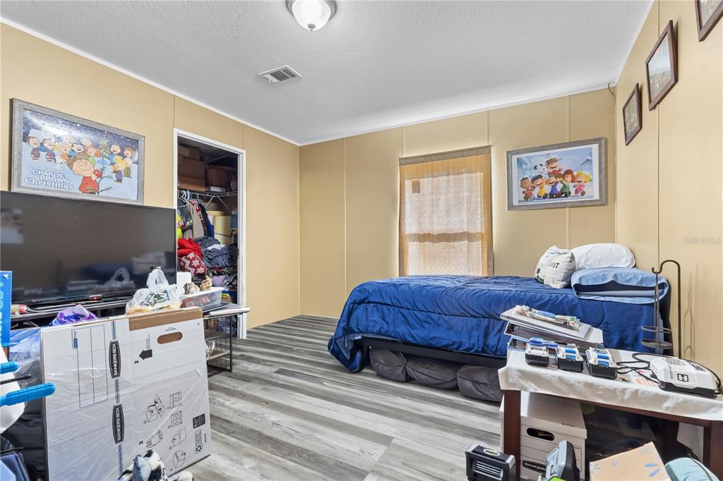 1650 Lyman Hendry Road, Unit 1 Perry, FL 32347 - Photo 5 of 30 a living room with furniture and a flat screen tv