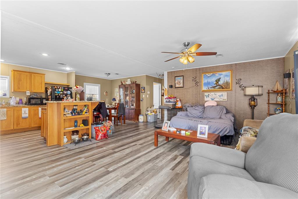 1650 Lyman Hendry Road, Unit 1 Perry, FL 32347 - Photo 10 of 30 a living room with furniture kitchen view and a wooden floor
