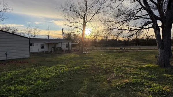 a view of a back yard of the house