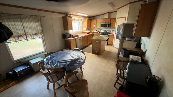 a kitchen with sink and window