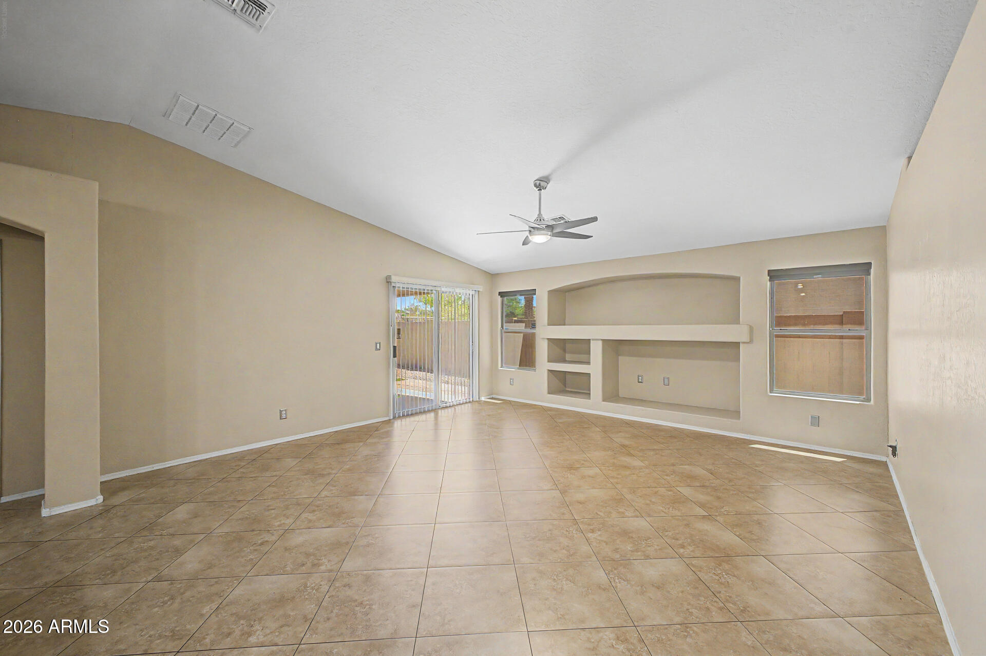2340 West Apollo Road Phoenix, AZ 85041 - Photo 3 of 26 a view of an empty room with a window