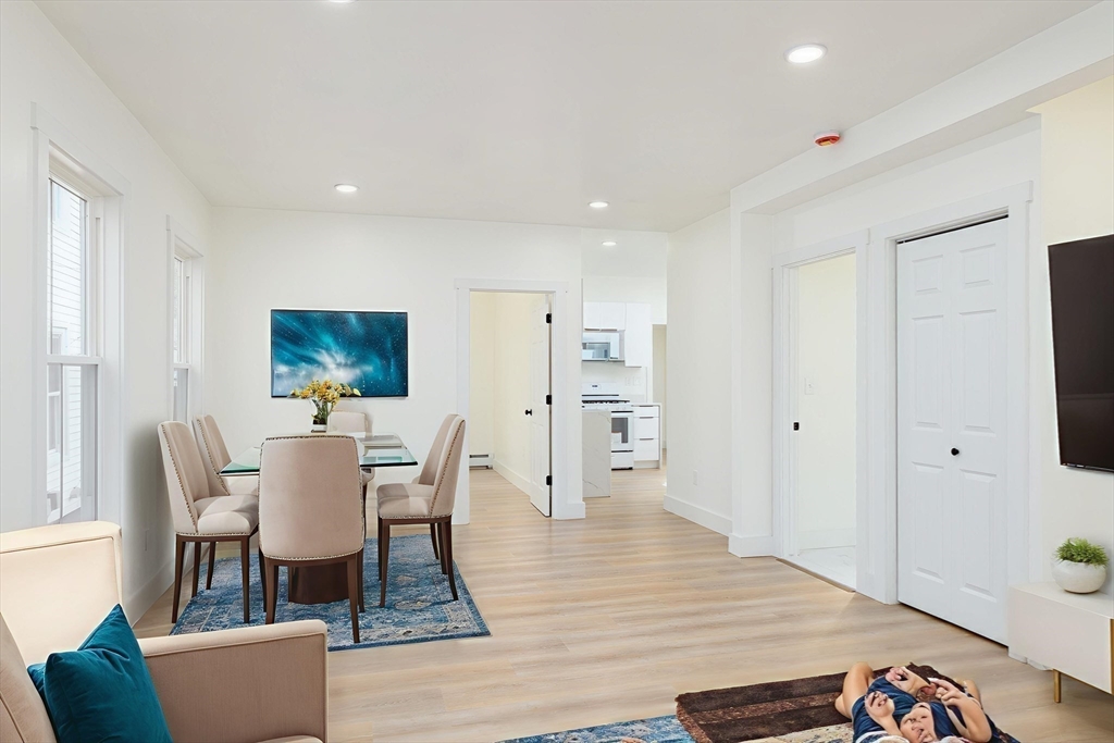33 Florence Street Worcester, MA 01610 - Photo 11 of 36 a view of a dining room with furniture and wooden floor