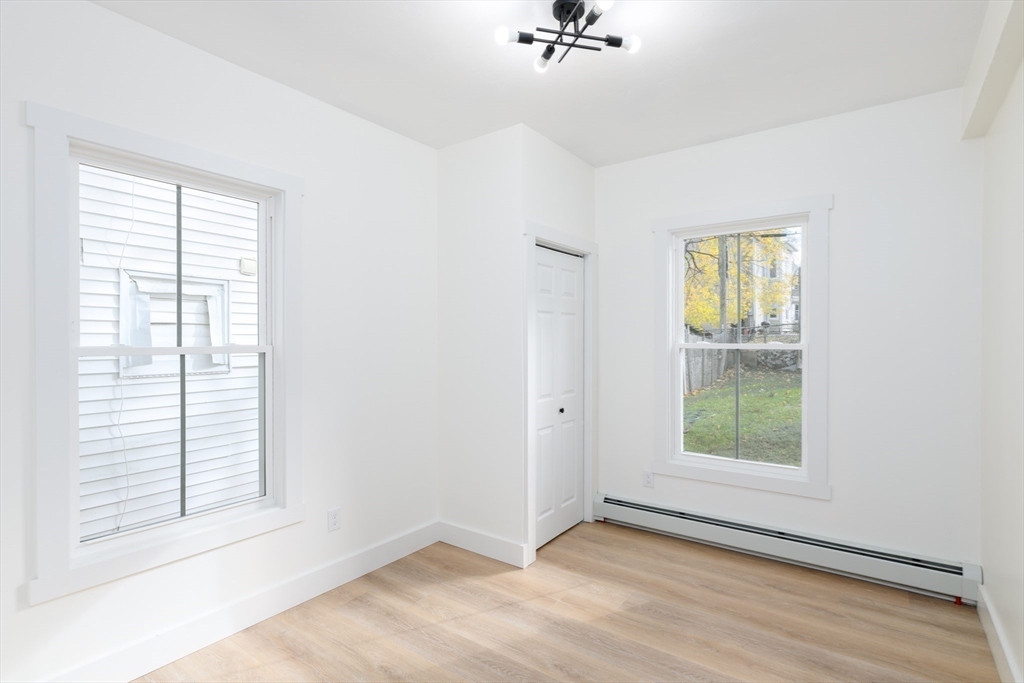33 Florence Street Worcester, MA 01610 - Photo 12 of 36 a view of an empty room with a window