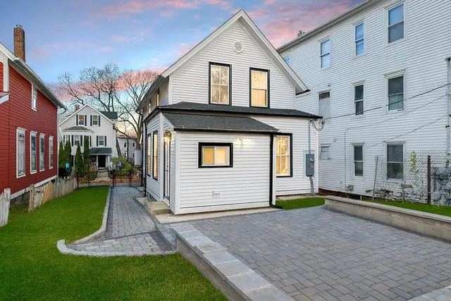a front view of a house with a yard