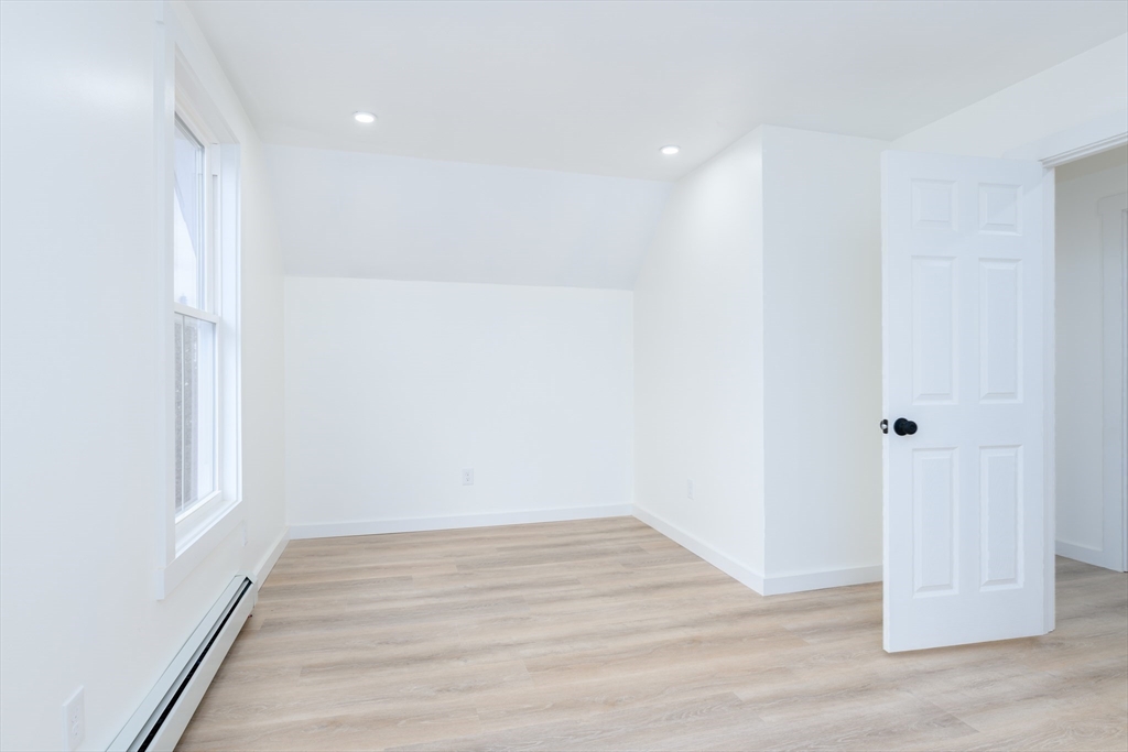 33 Florence Street Worcester, MA 01610 - Photo 21 of 36 a view of room with wooden floor