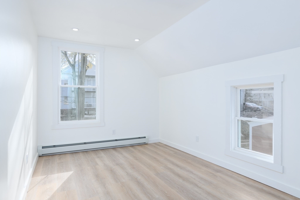 33 Florence Street Worcester, MA 01610 - Photo 23 of 36 an empty room with a window