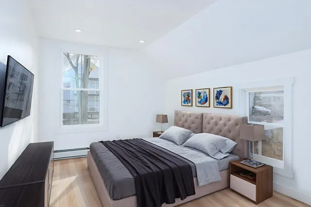 a bedroom with a bed and a couch