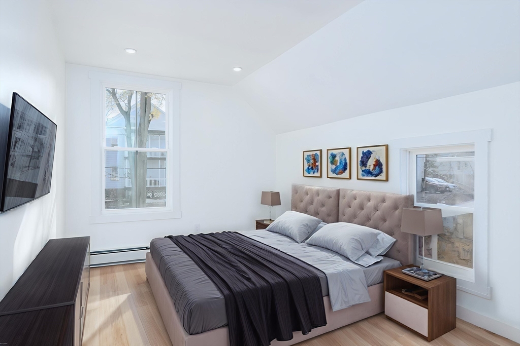 33 Florence Street Worcester, MA 01610 - Photo 24 of 36 a bedroom with a bed and a couch