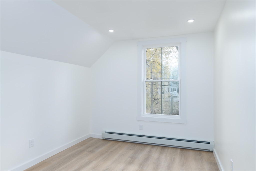 33 Florence Street Worcester, MA 01610 - Photo 25 of 36 an empty room with a window