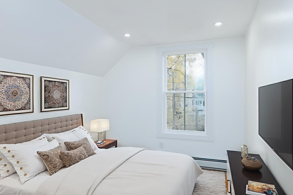 33 Florence Street Worcester, MA 01610 - Photo 26 of 36 a bedroom with a bed and a window