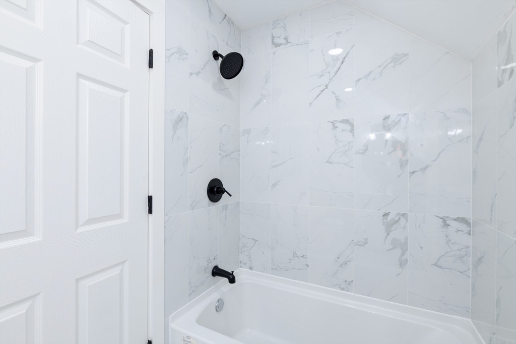 33 Florence Street Worcester, MA 01610 - Photo 28 of 36 a bathroom with a bathtub and shower