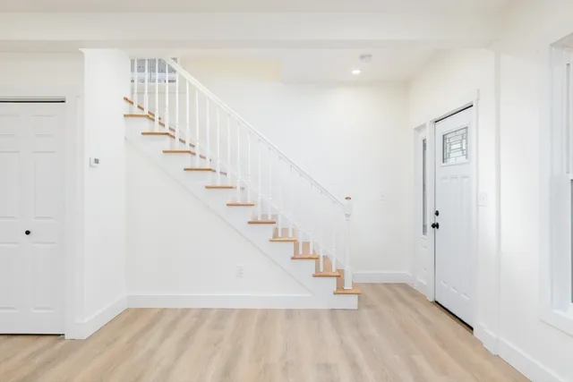 a view of entryway with wooden floor