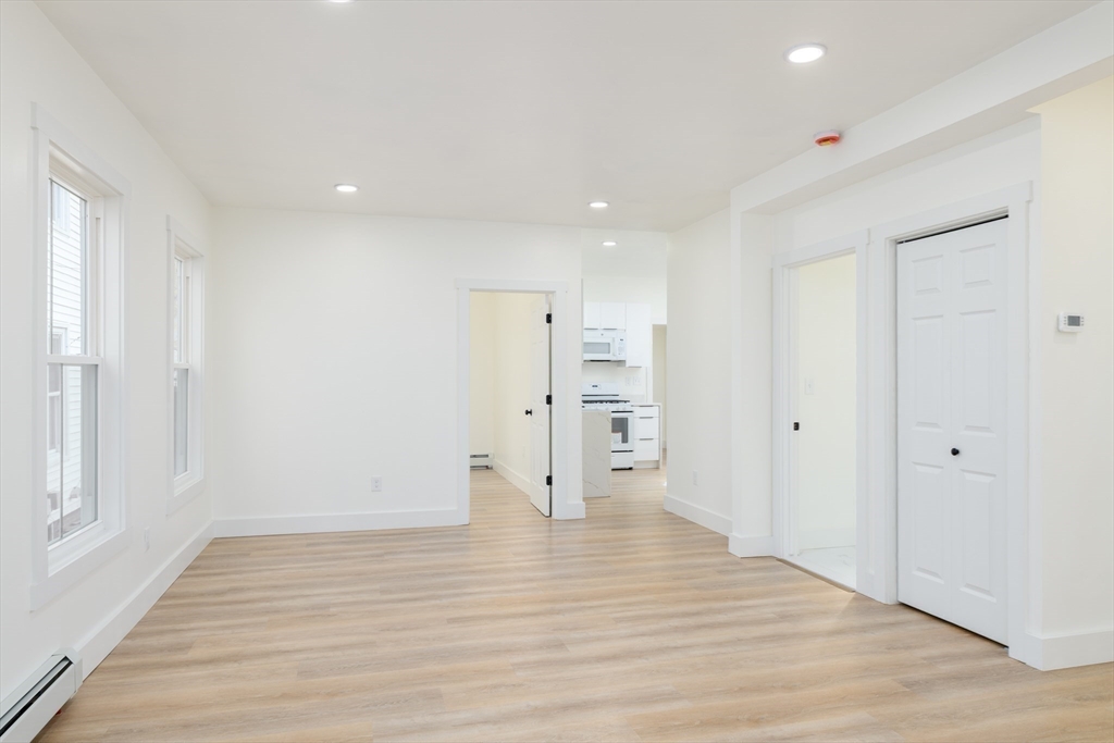 33 Florence Street Worcester, MA 01610 - Photo 10 of 36 a view of empty room with wooden floor