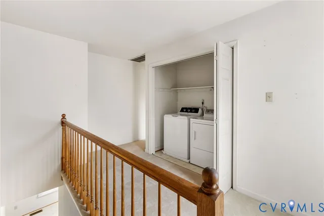 a view of hallway with washer and dryer