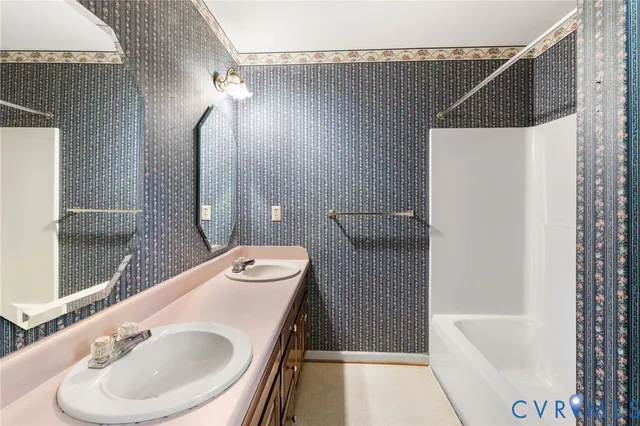 a bathroom with a sink a toilet and tub