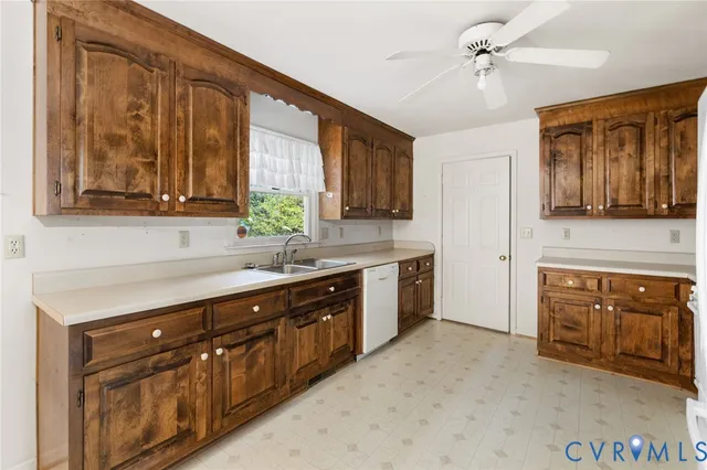 a kitchen with stainless steel appliances granite countertop a stove sink and cabinets
