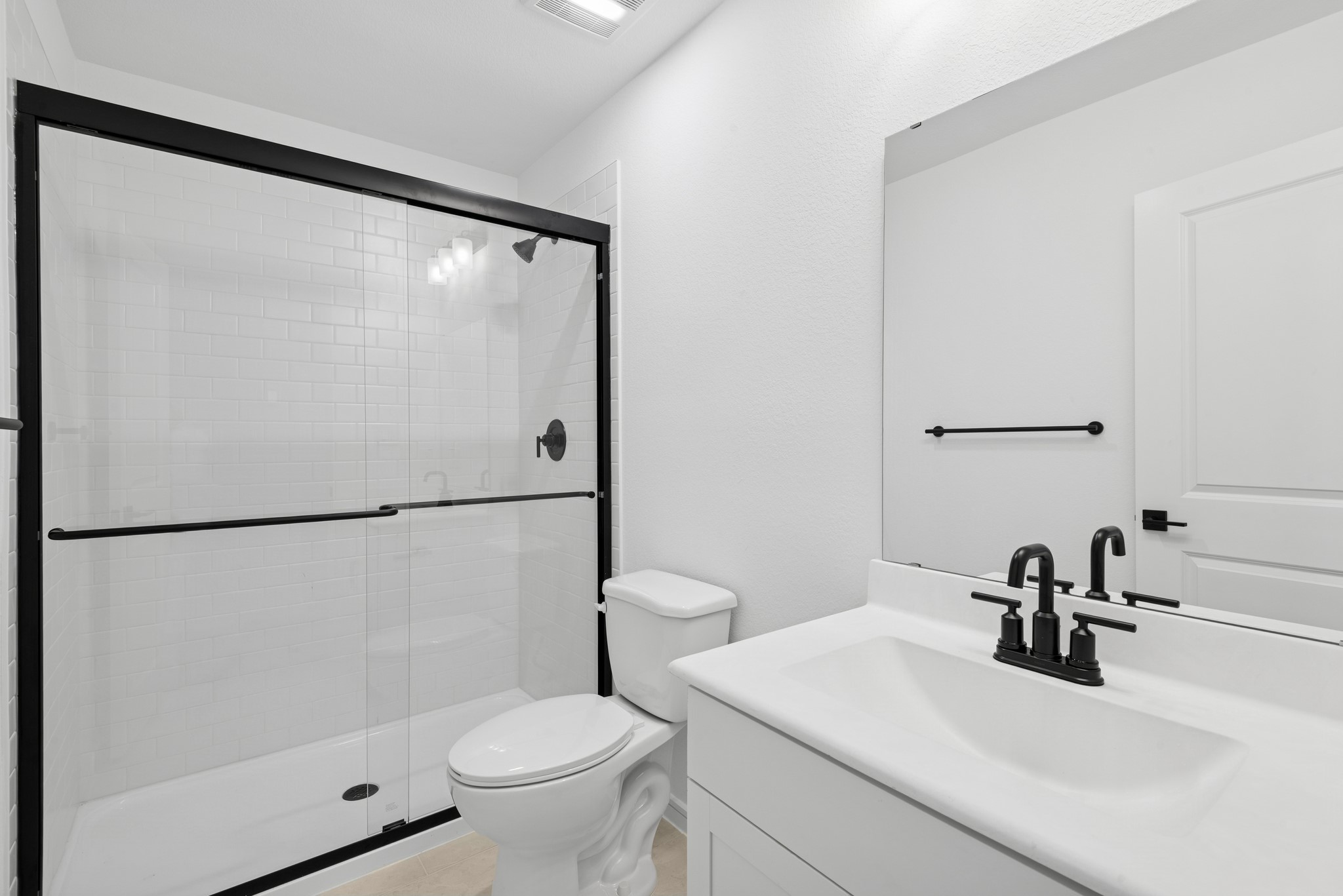 2606 Wastelbread Lane Rosenberg, TX 77471 - Photo 18 of 46 a bathroom with a sink toilet and a mirror