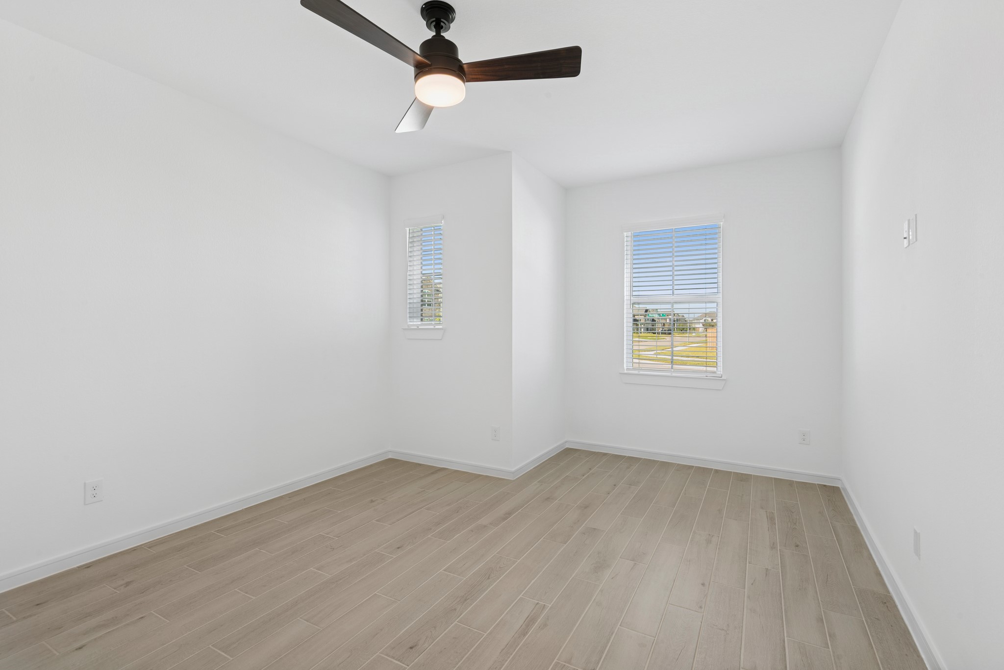 2606 Wastelbread Lane Rosenberg, TX 77471 - Photo 3 of 46 an empty room with a window and ceiling fan