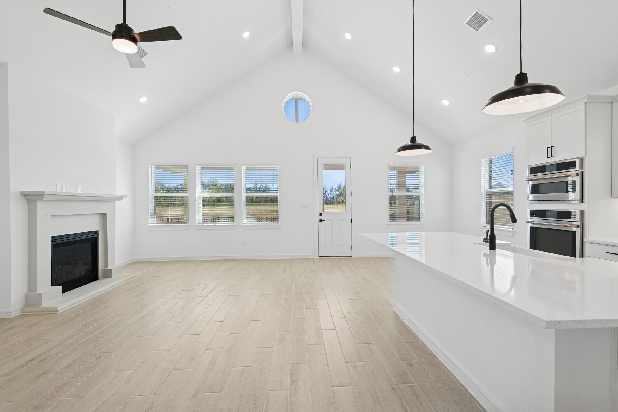 2606 Wastelbread Lane Rosenberg, TX 77471 - Photo 6 of 46 a view of a kitchen with furniture and a fireplace