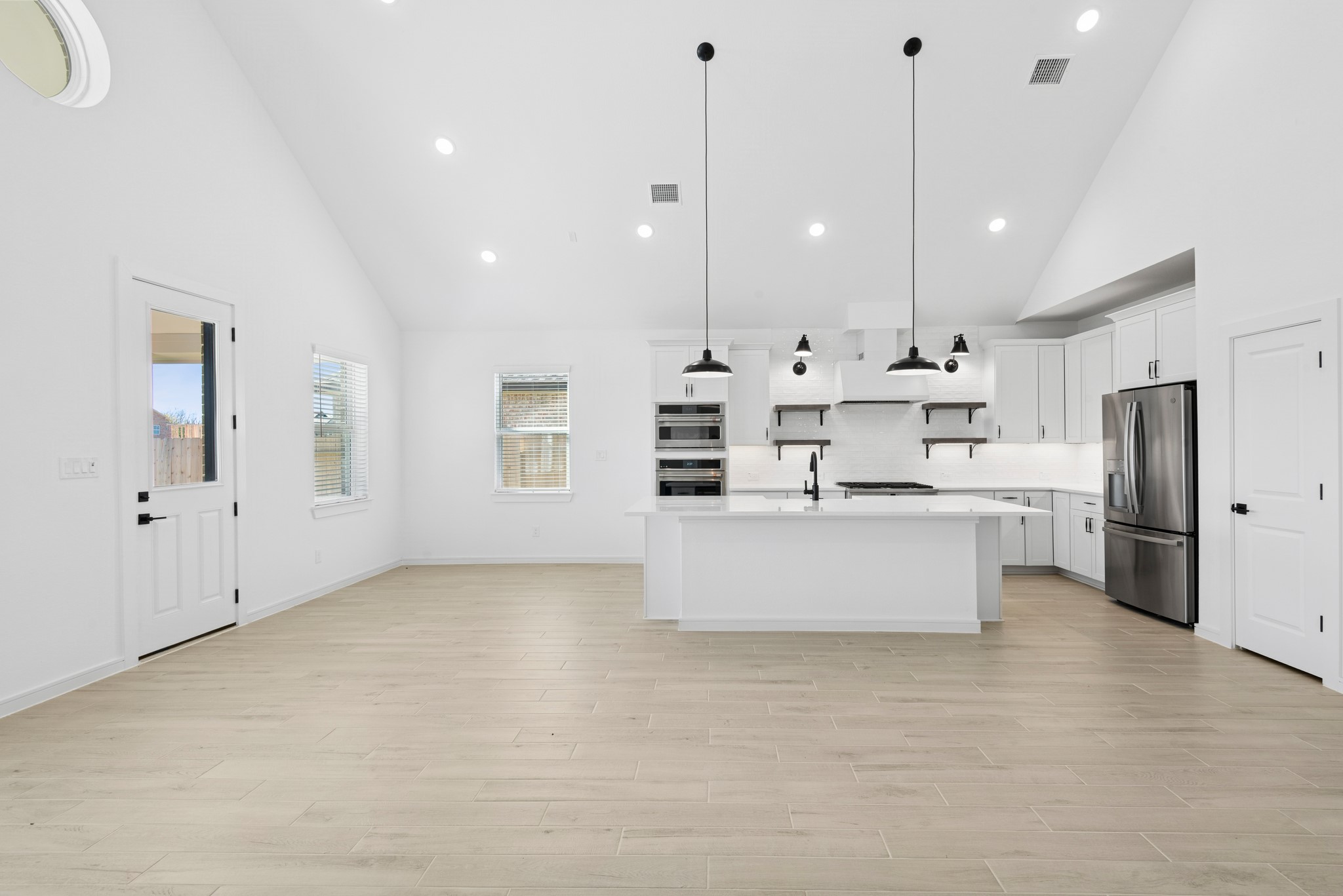 2606 Wastelbread Lane Rosenberg, TX 77471 - Photo 7 of 46 a large kitchen with a large counter top appliances and cabinets