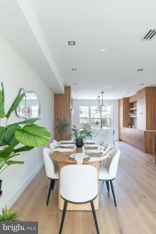 a kitchen with stainless steel appliances a sink stove and cabinets