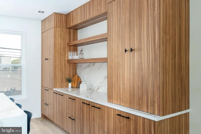 a bathroom with a toilet sink and shower