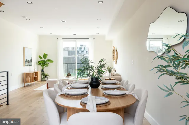 a view of entryway and gallery with wooden floor