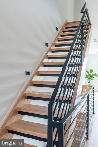 a bathroom with a white tub shower and a sink