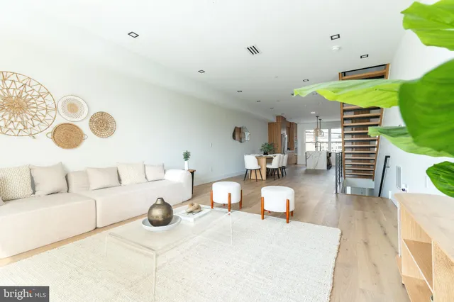 a dining room with furniture and wooden floor